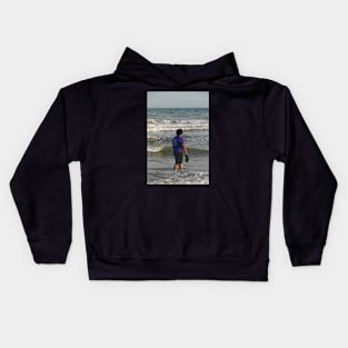 Young lady on the beach Kids Hoodie